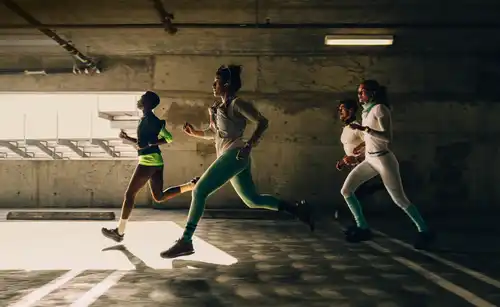 A group of people running in a city while wearing Apple Watch Series 12
