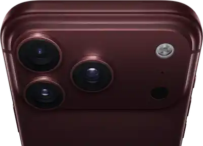 جهاز iPhone 18 Pro Max، بلون عنّابي (أحمر داكن)، الجهة الخارجية الخلفية، نظام كاميرات Pro Fusion في الأعلى، 3 عدسات، شفرات فتحة عدسة متغيرة مغلقة جزئياً، فلاش، ميكروفون وماسح ضوئي بتكنولوجيا لايدار، الجهة الخارجية العلوية، هوائي خلوي، جوانب مسطحة، حواف مدورة