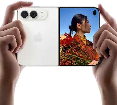 iPhone Duo, Star White color, held by two hands in horizontal orientation, unfolded, left panel shows 48MP Dual Fusion rear cameras, right panel shows person getting their picture taken on outer display, the subject of the photo is able to see their face as their picture is getting taken using Duo Preview